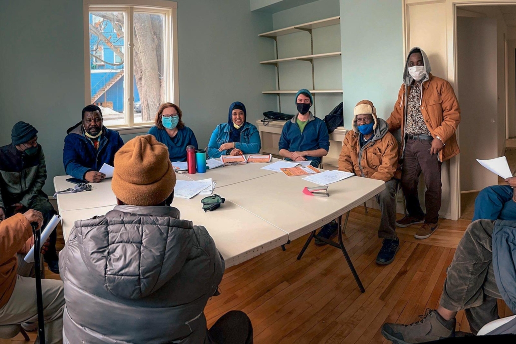 The Somali Bantu Community Association of Maine’s directors hold a meeting at their new headquarters. Plans are in the works to build a larger conference room